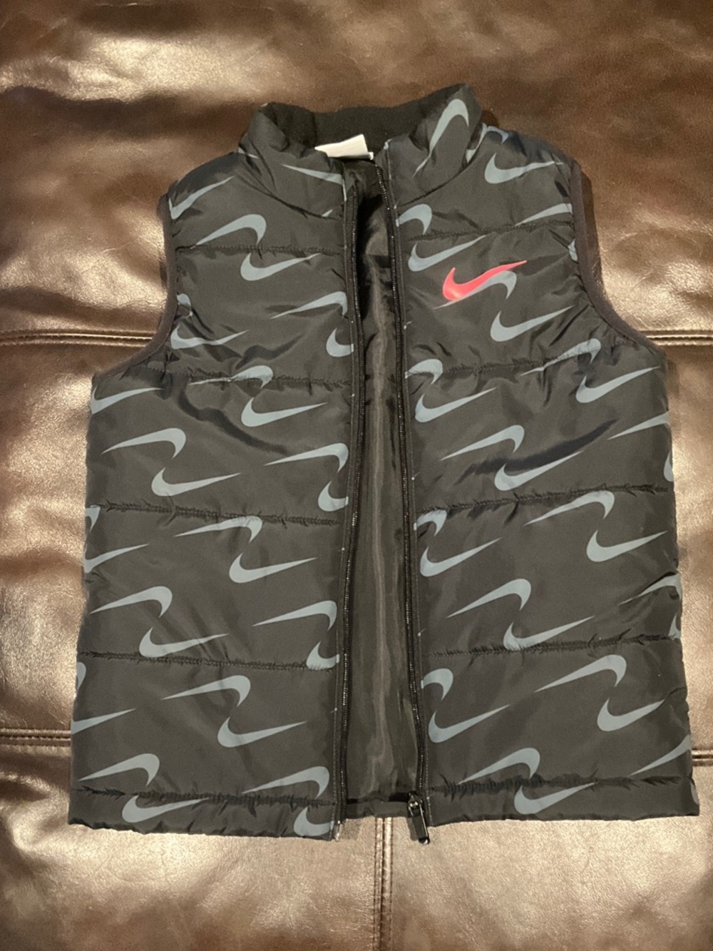 Nike Black Puffer Vest with Grey Swoosh Print and Red Logo